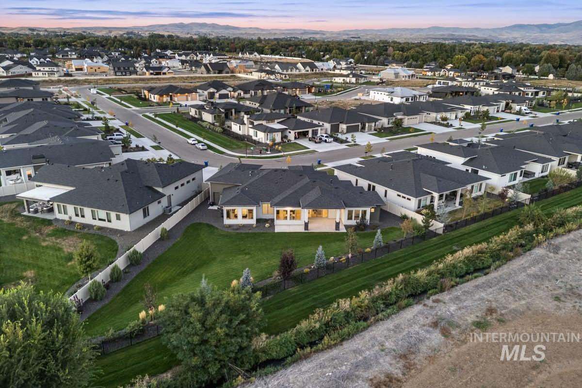 Aerial view of residential area featuring mountains