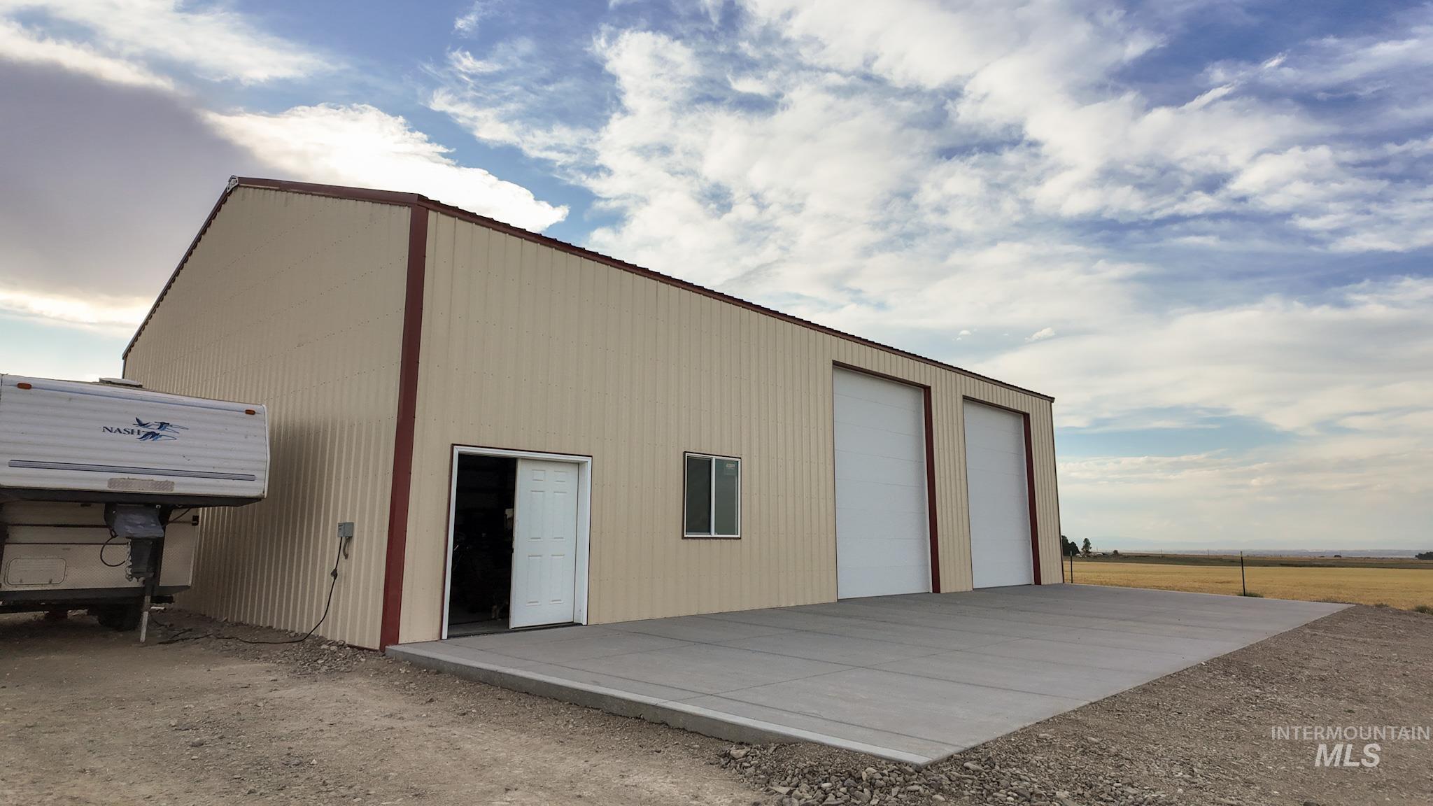 NEW 40x60 RV Shop w Lift - 4 Inch Concrete Floor with Fiber Mesh and Large Apron 2 Mandoors 4-Windows and 2 Large 12 x 14 Doors