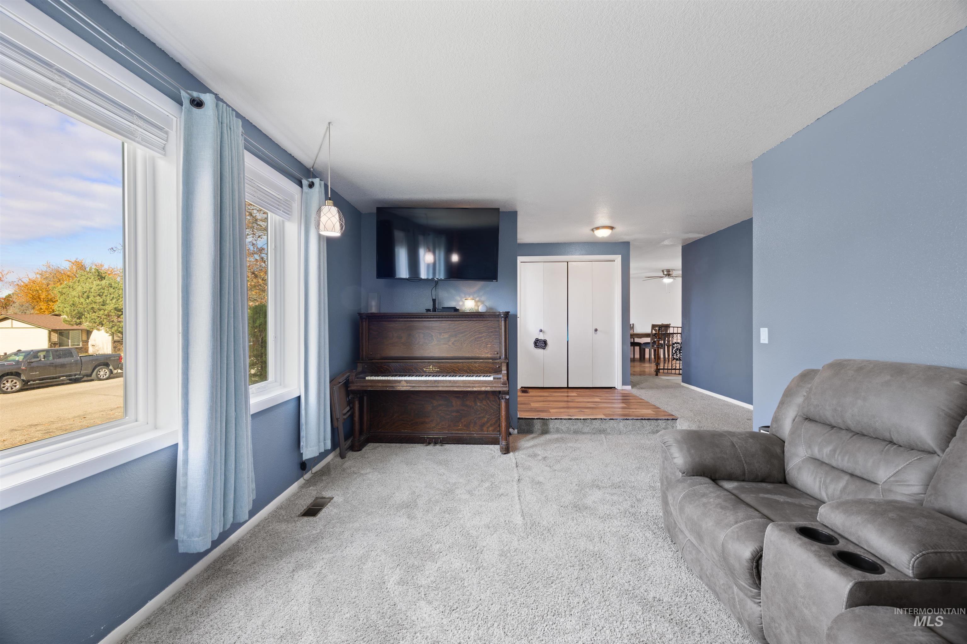 Living area with carpet floors and baseboards