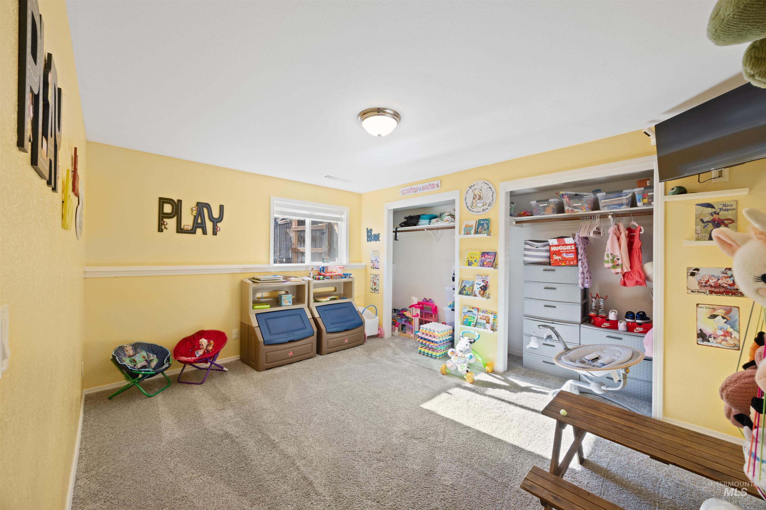 Rec room featuring carpet flooring and baseboards