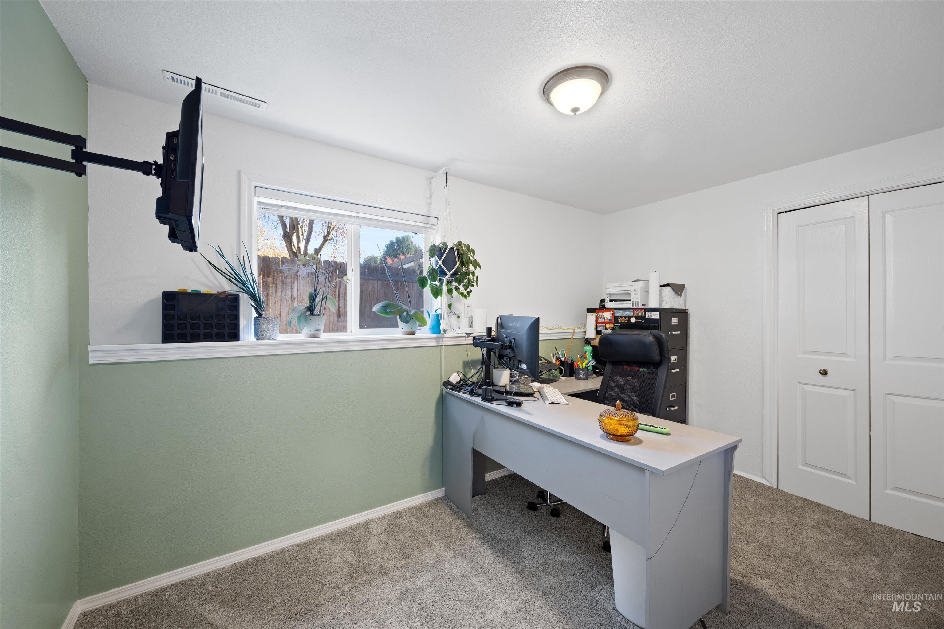 Office area with light colored carpet