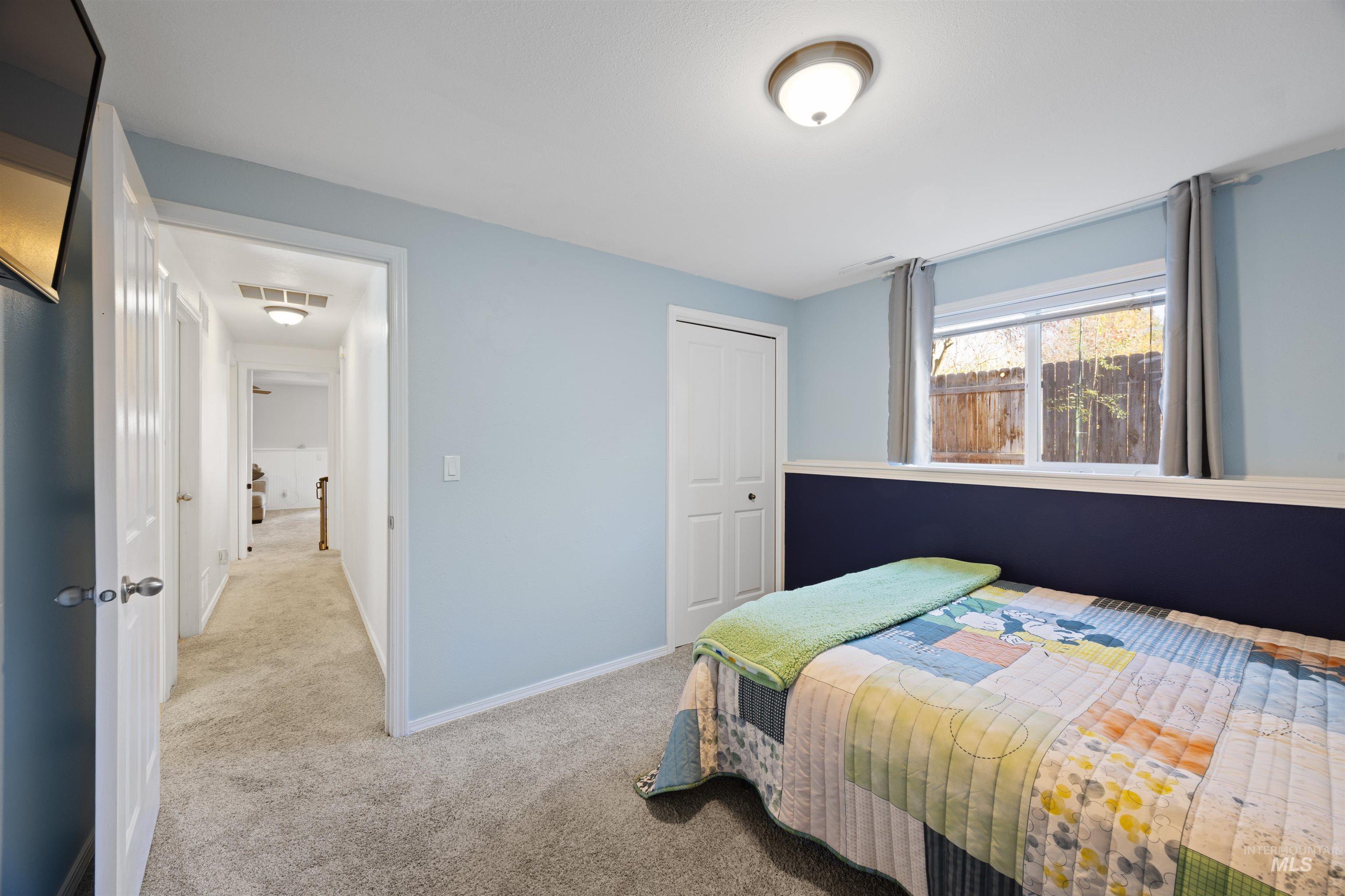 Bedroom with carpet floors and a closet