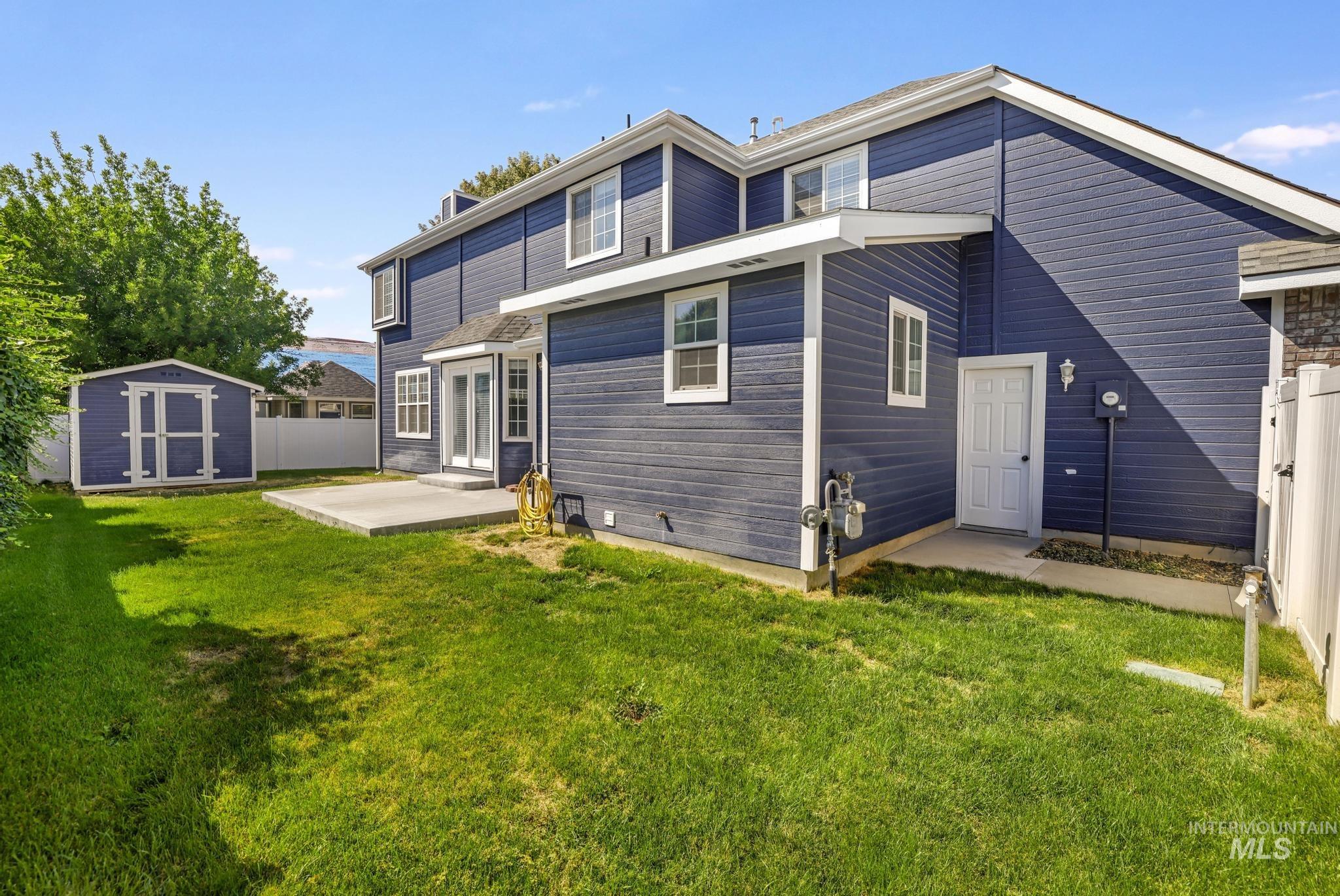 Back of property featuring a shed
