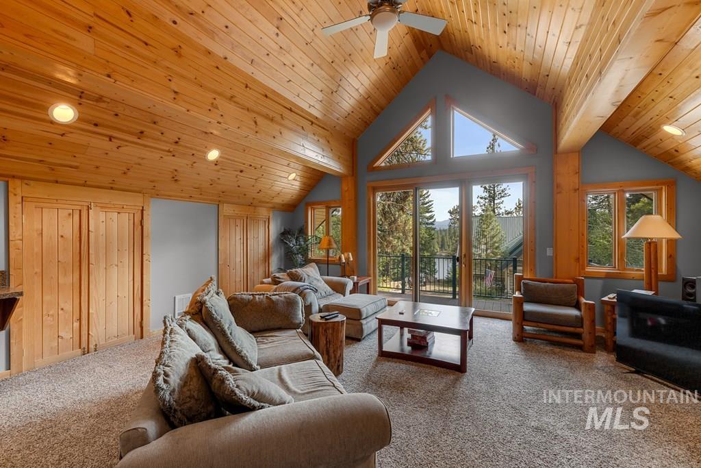Vaulted wood-finish ceilings featuring recessed lighting and a ceiling fan