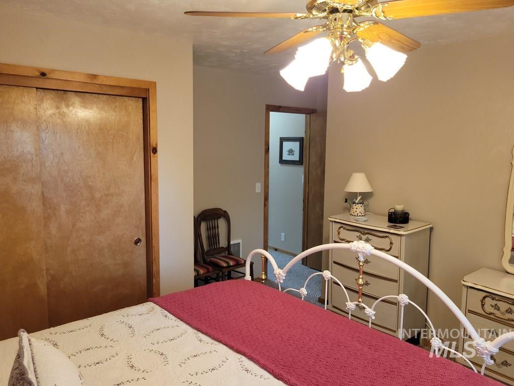 Bedroom with a closet and ceiling fan