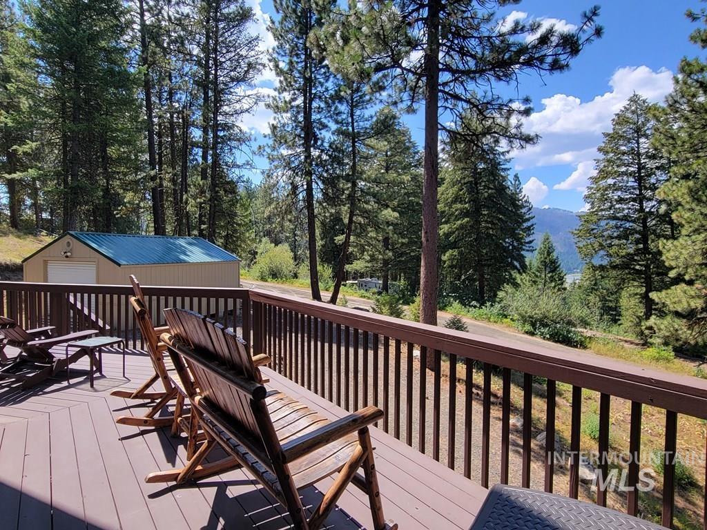 Deck featuring an outbuilding and a garage