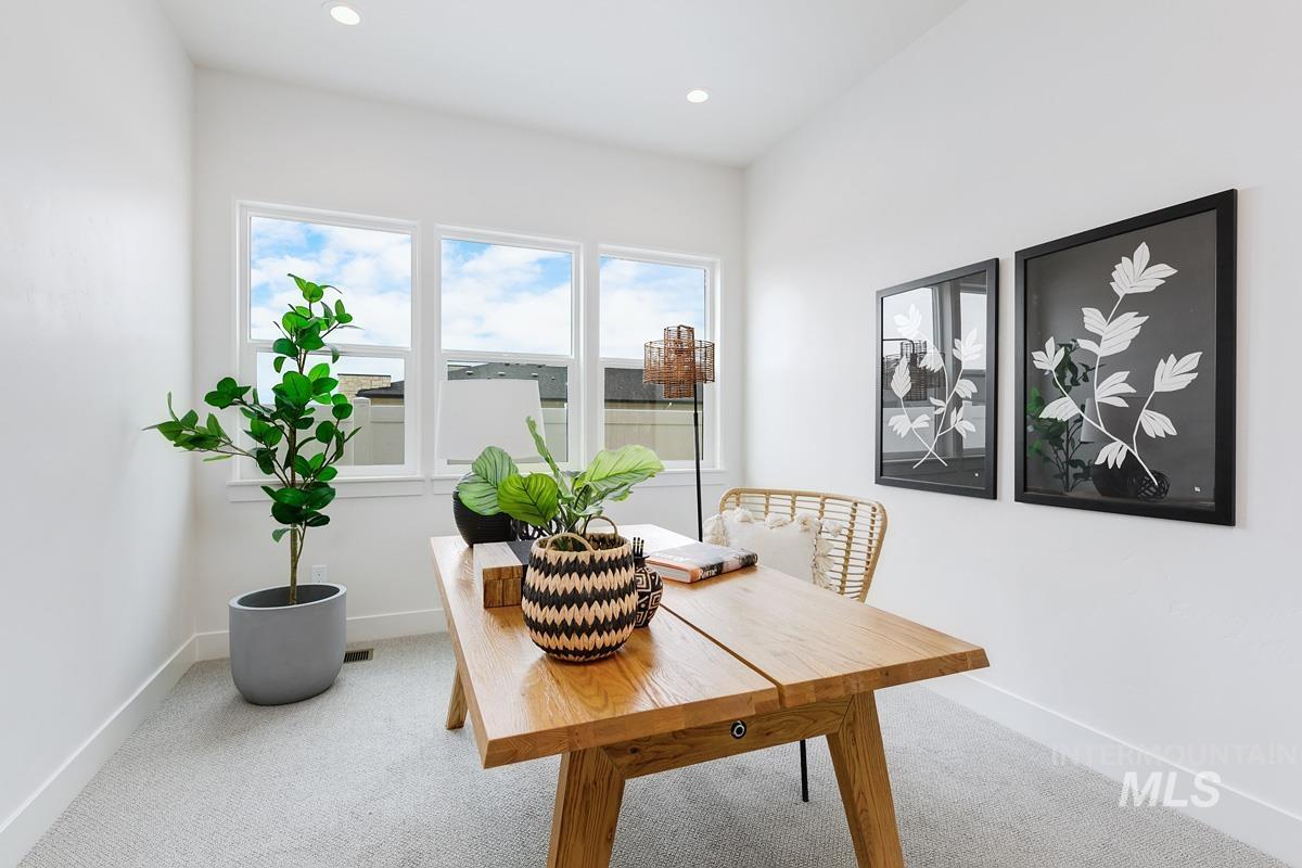 Dining room featuring carpet, an office area, and recessed lighting
