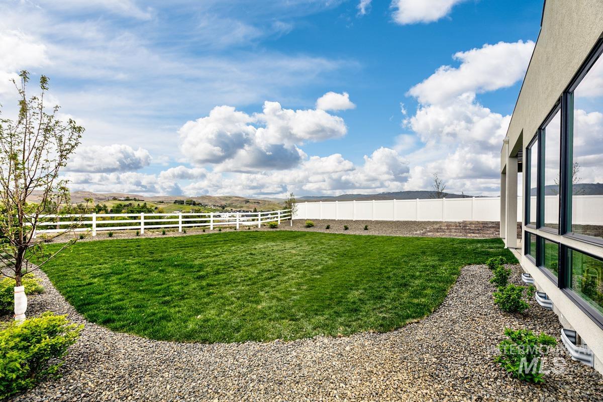 View of fenced backyard