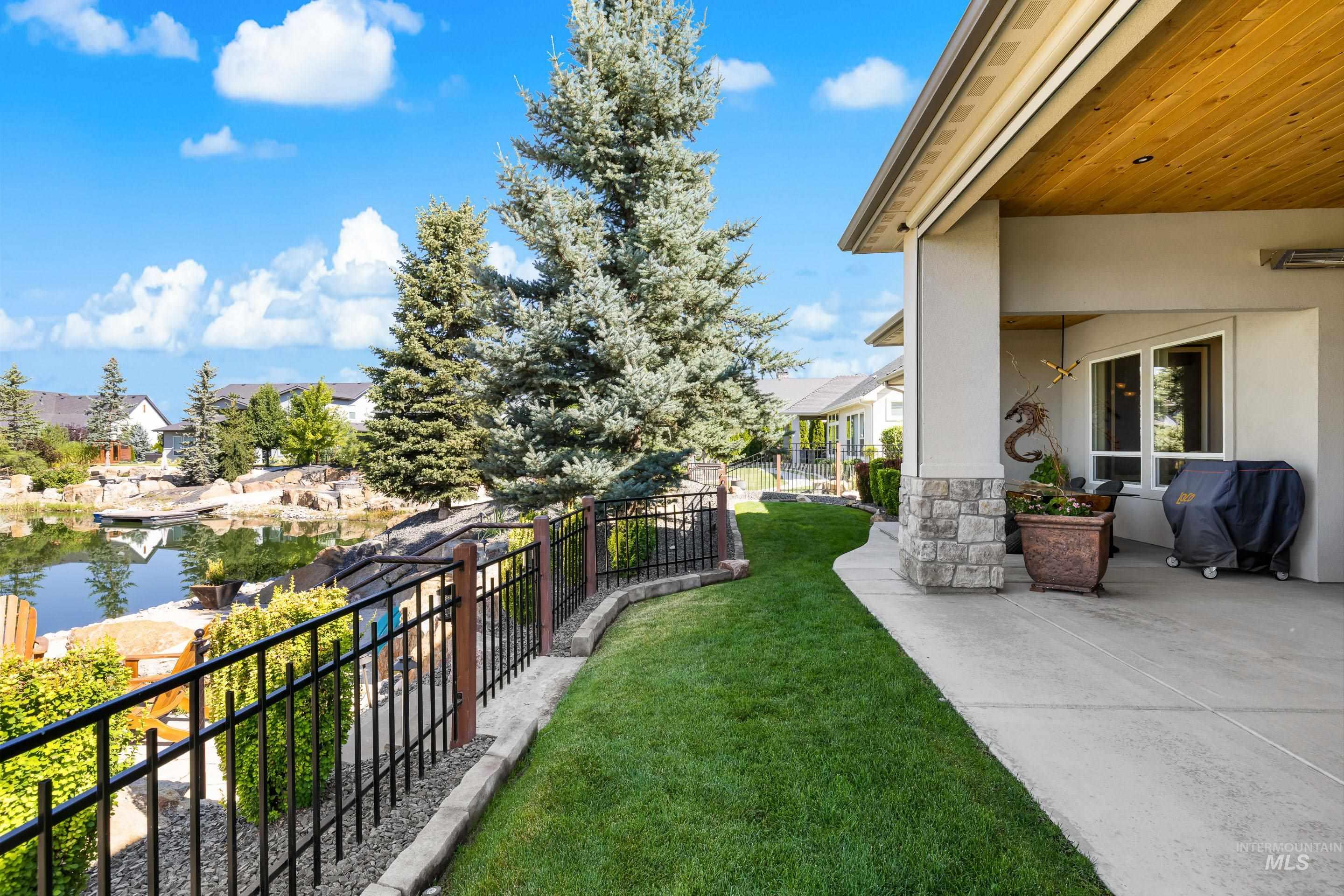 View of yard featuring a patio area and a water view