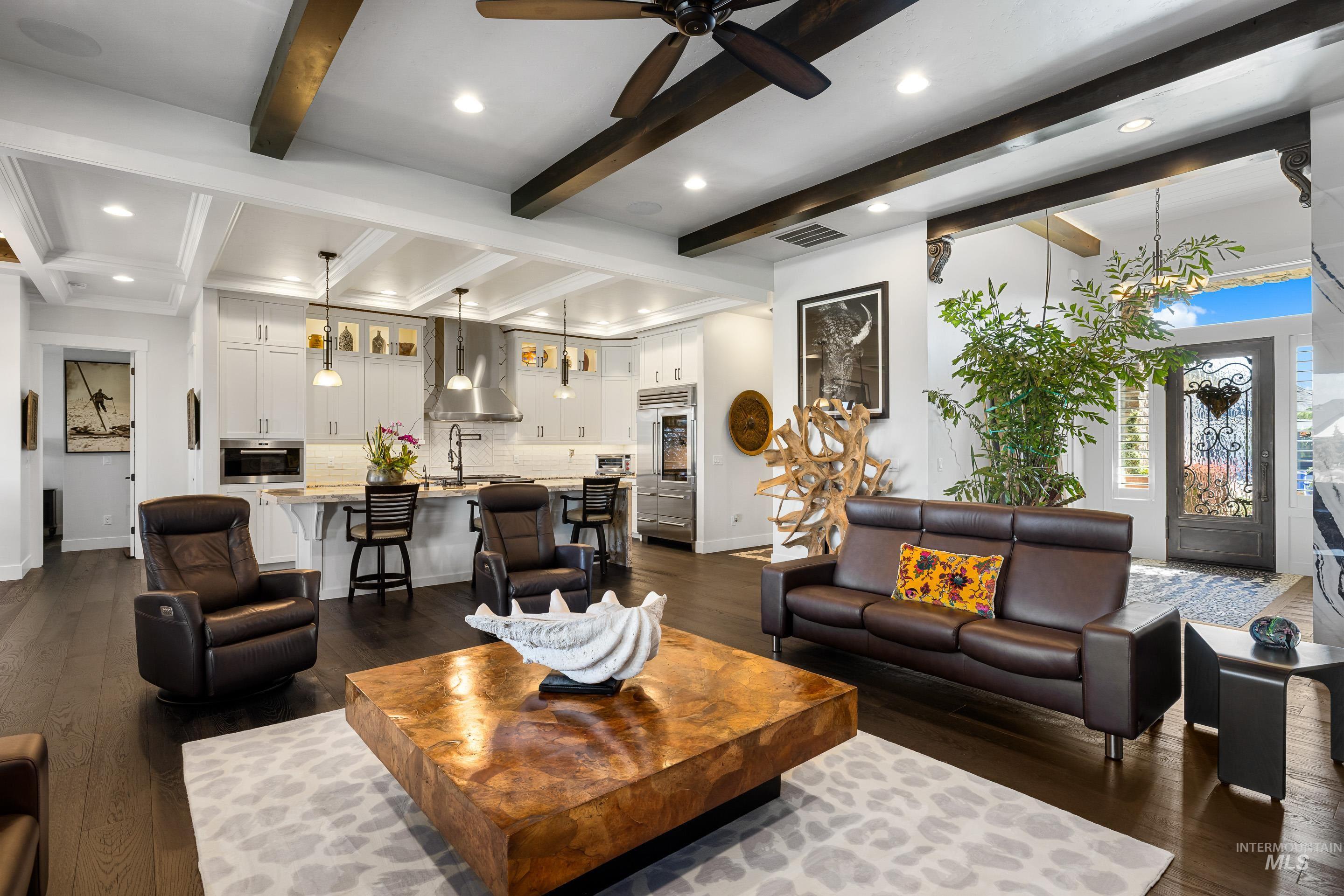 Living room with recessed lighting, dark wood finished floors, beamed ceiling, and a ceiling fan