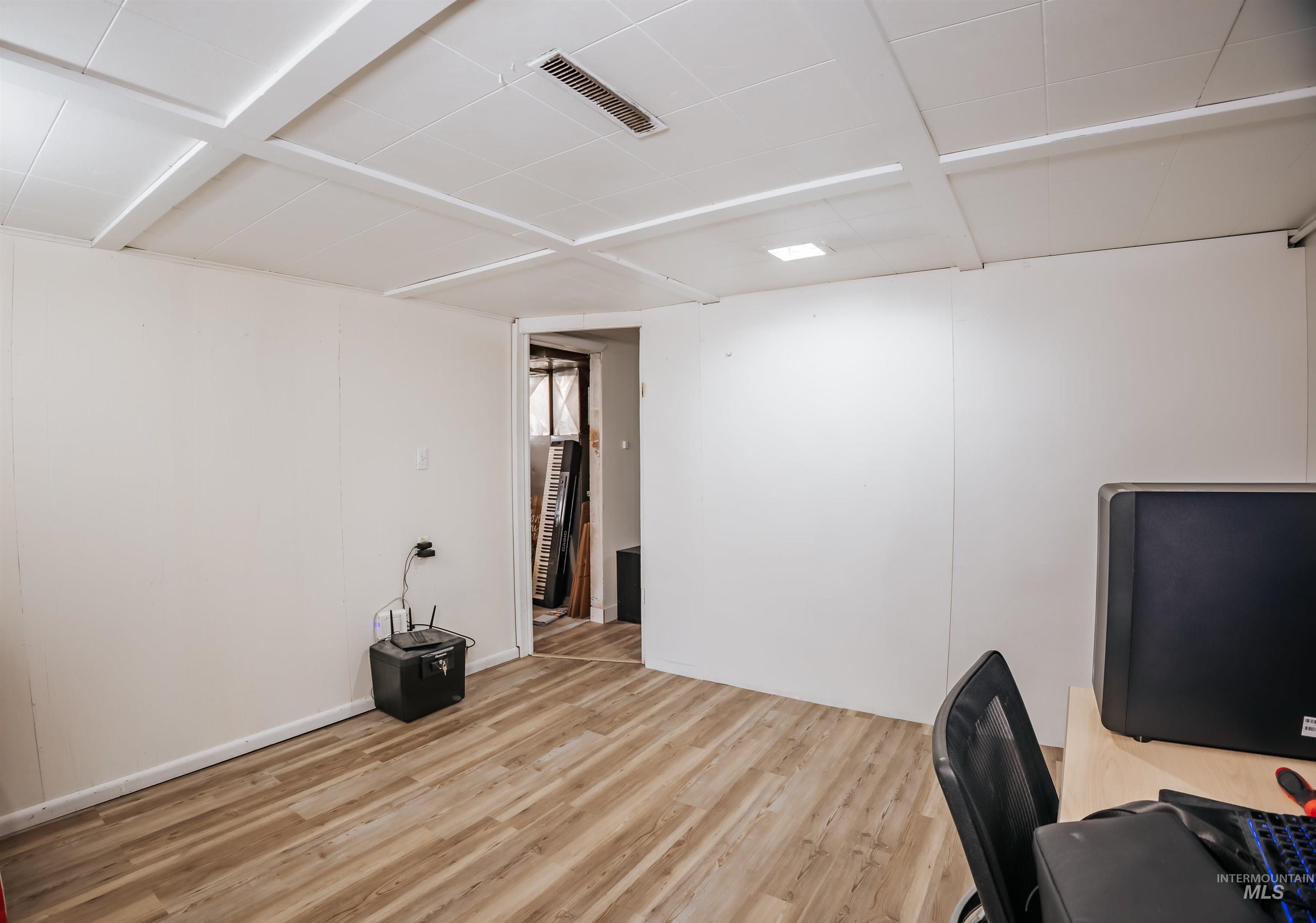Office space featuring wood finished floors
