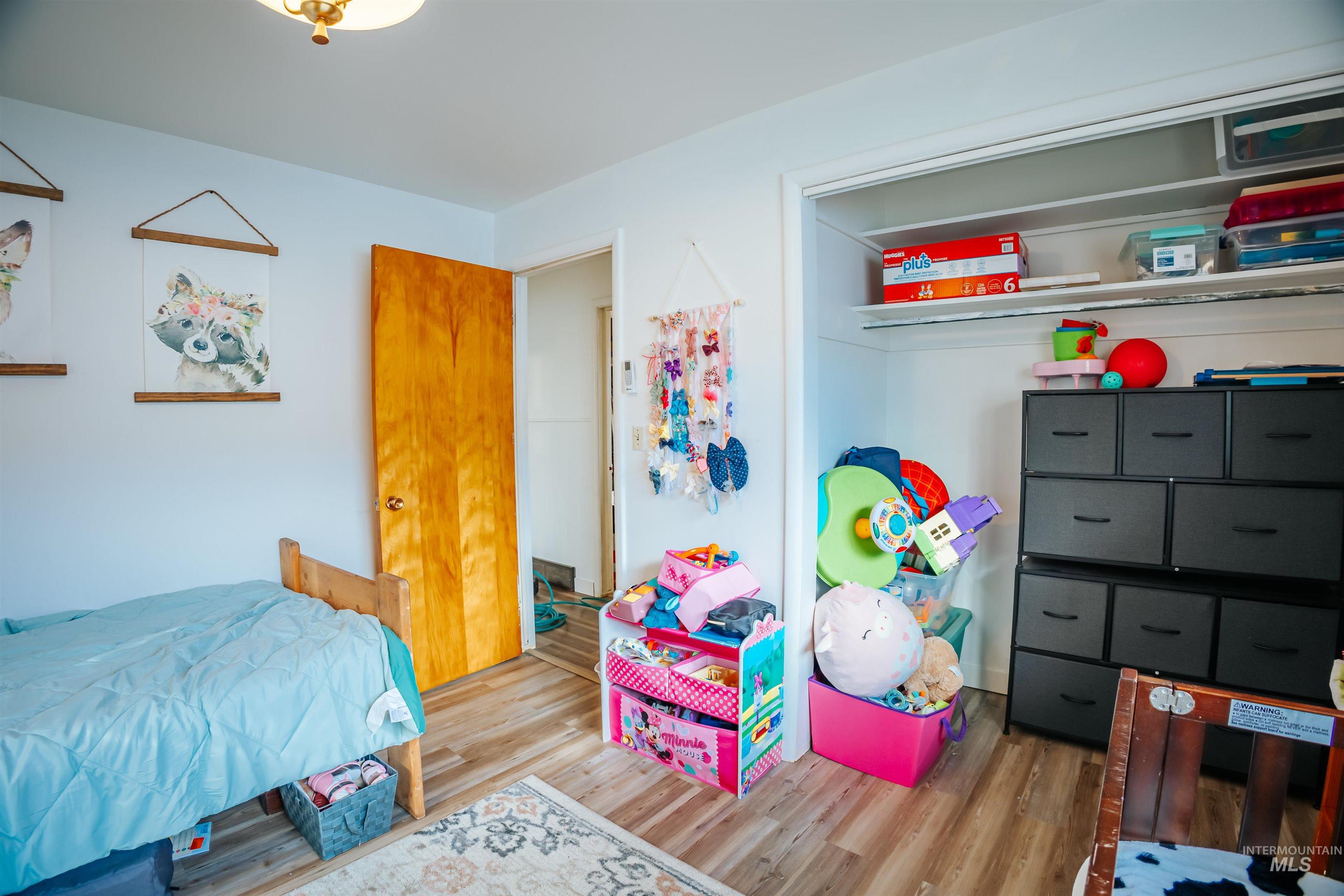 Bedroom featuring wood finished floors