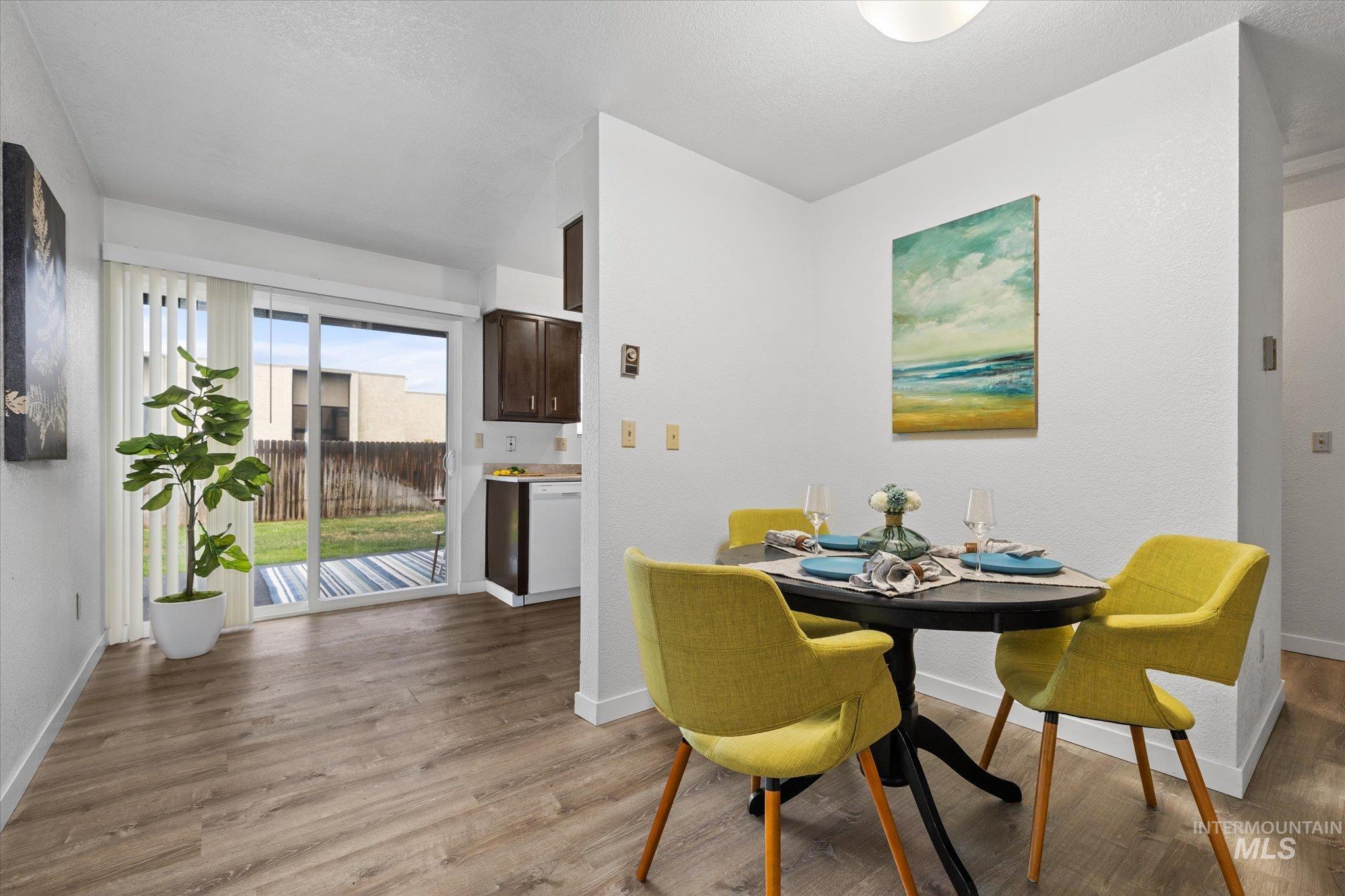 Dining space featuring baseboards and light wood-style flooring