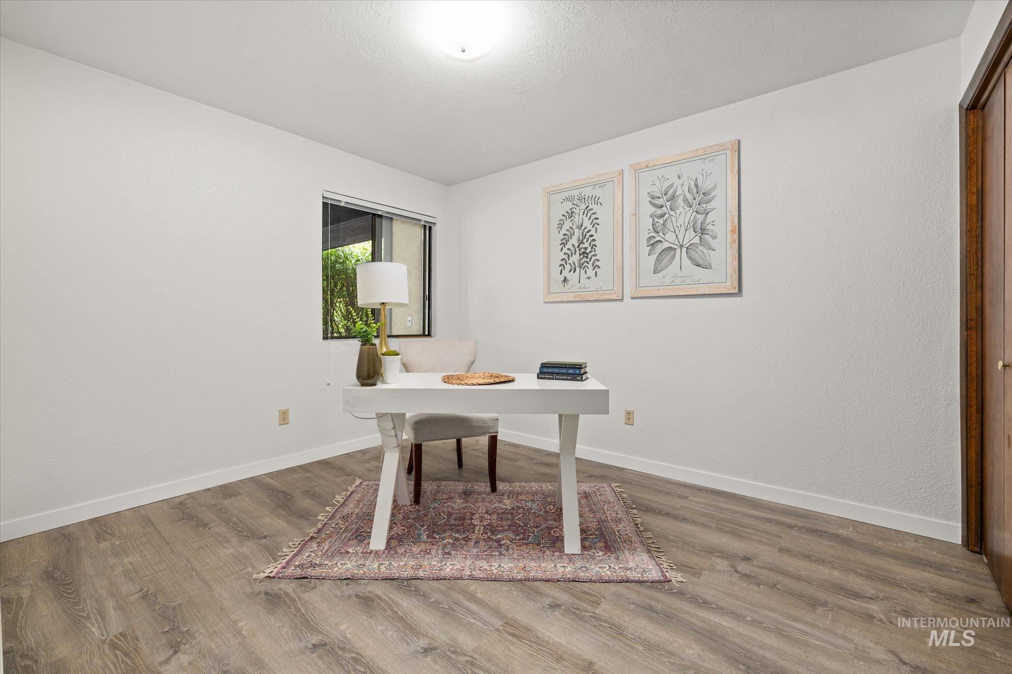 Office space featuring wood finished floors
