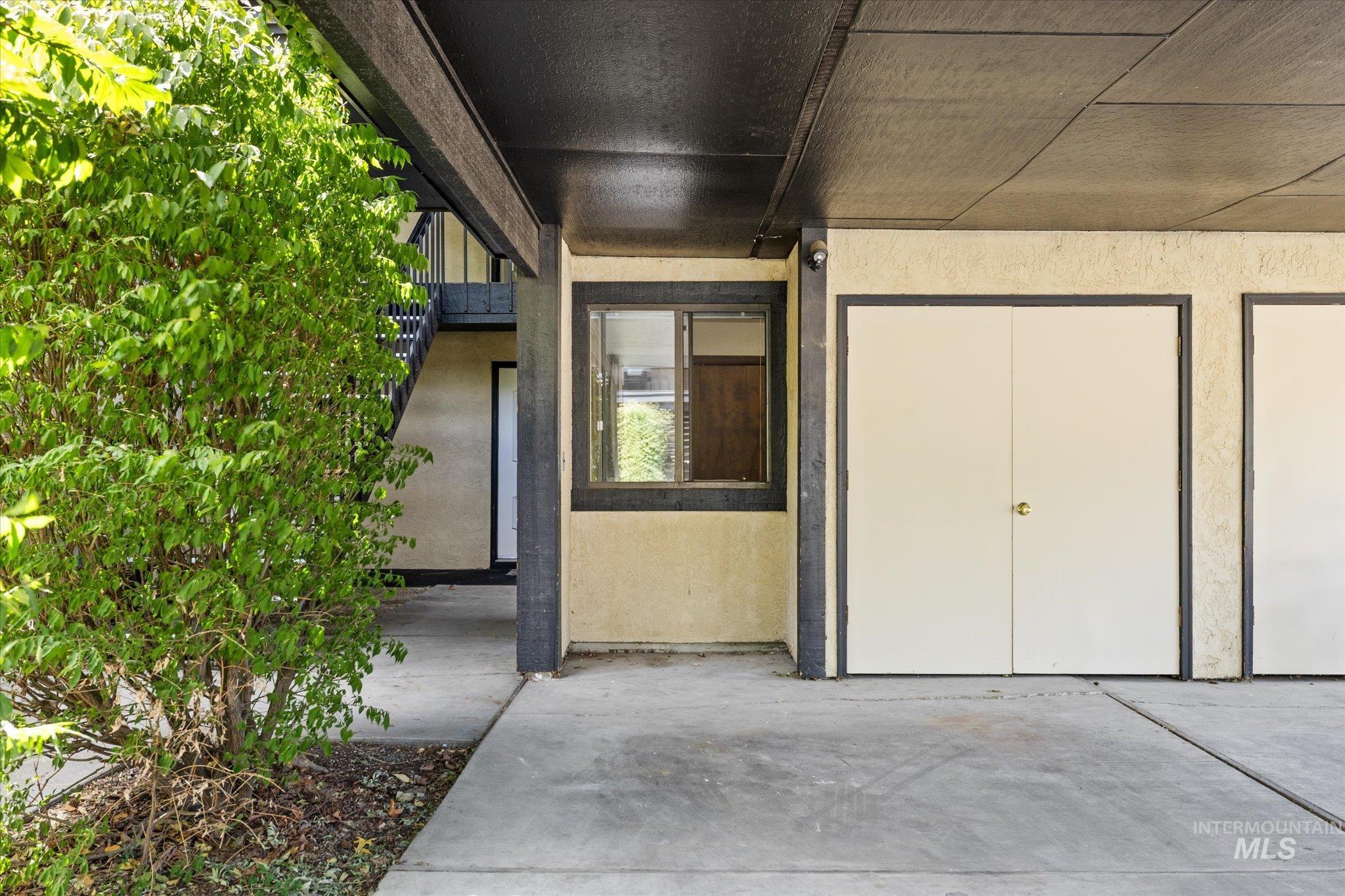 Doorway to property with stucco siding