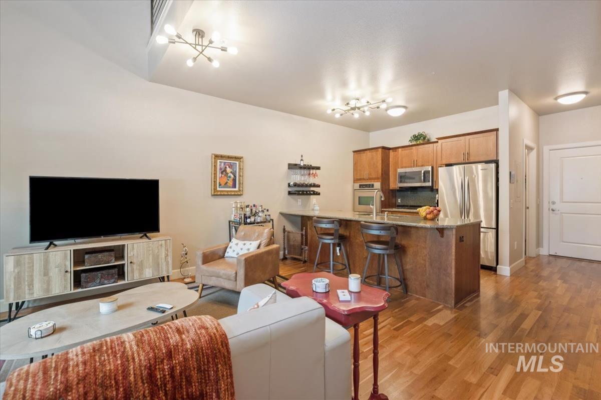 Living area featuring light wood finished floors and baseboards