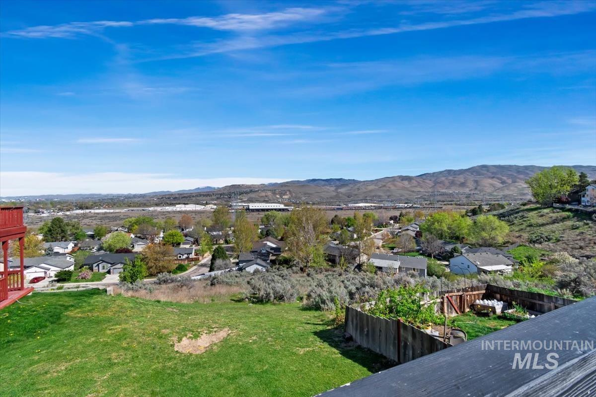 View of mountain backdrop with nearby suburban area
