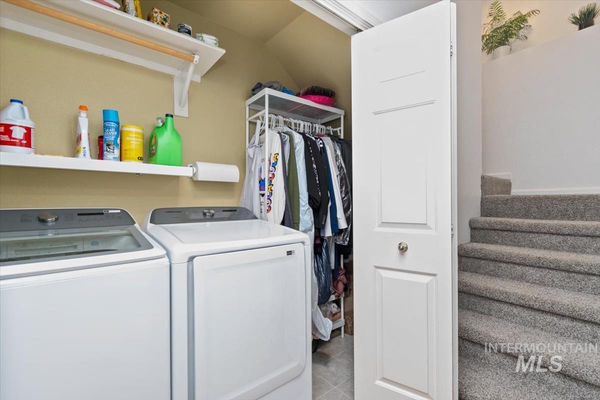 Laundry area featuring washing machine and clothes dryer