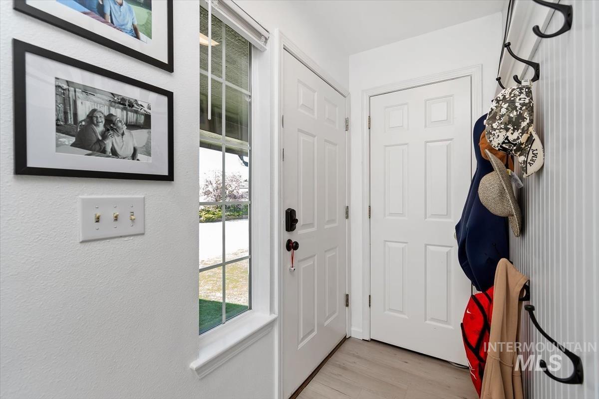 Entryway with wood finished floors