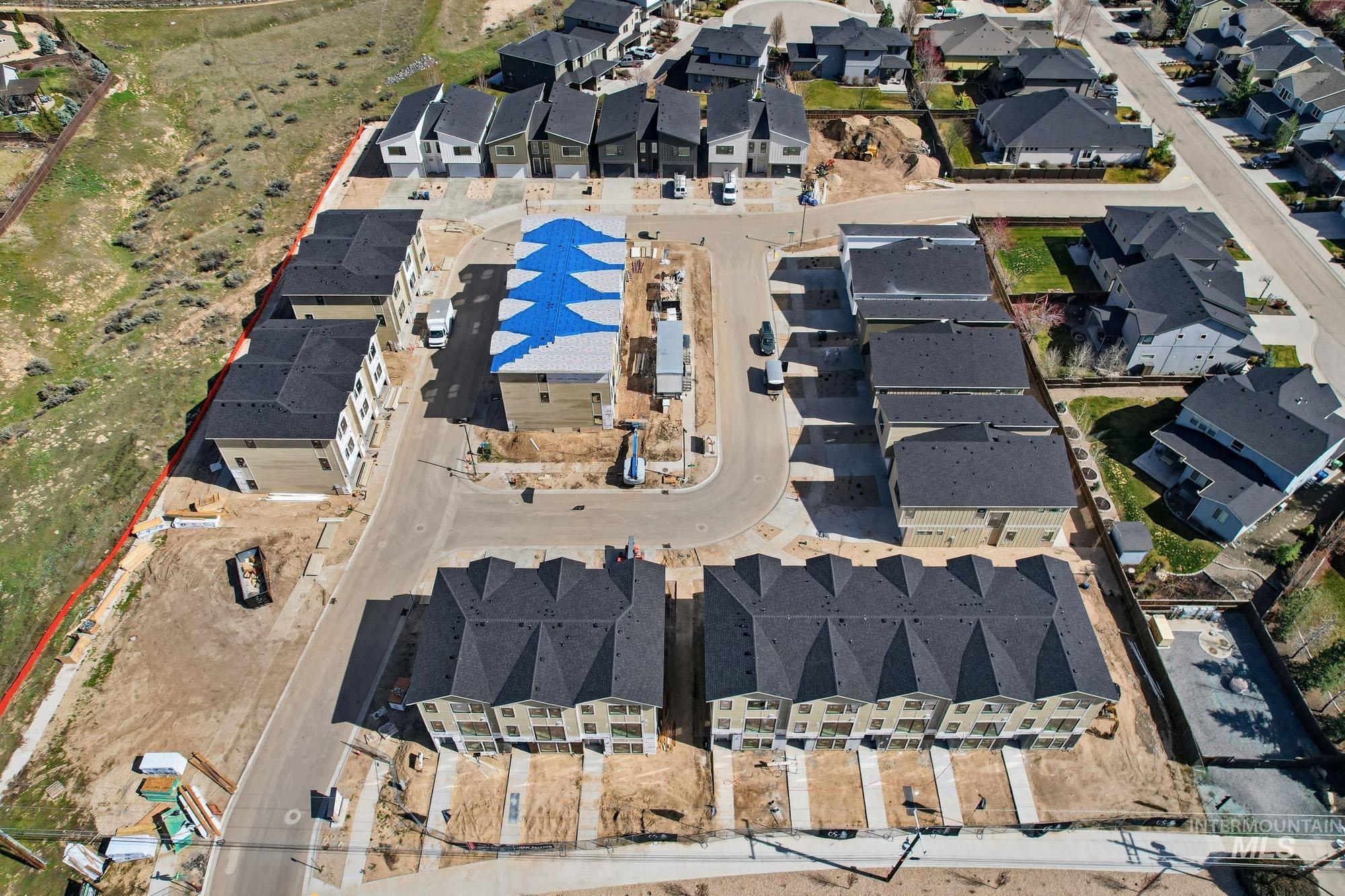 Developing residential community featuring multi-level townhomes and single-family residences