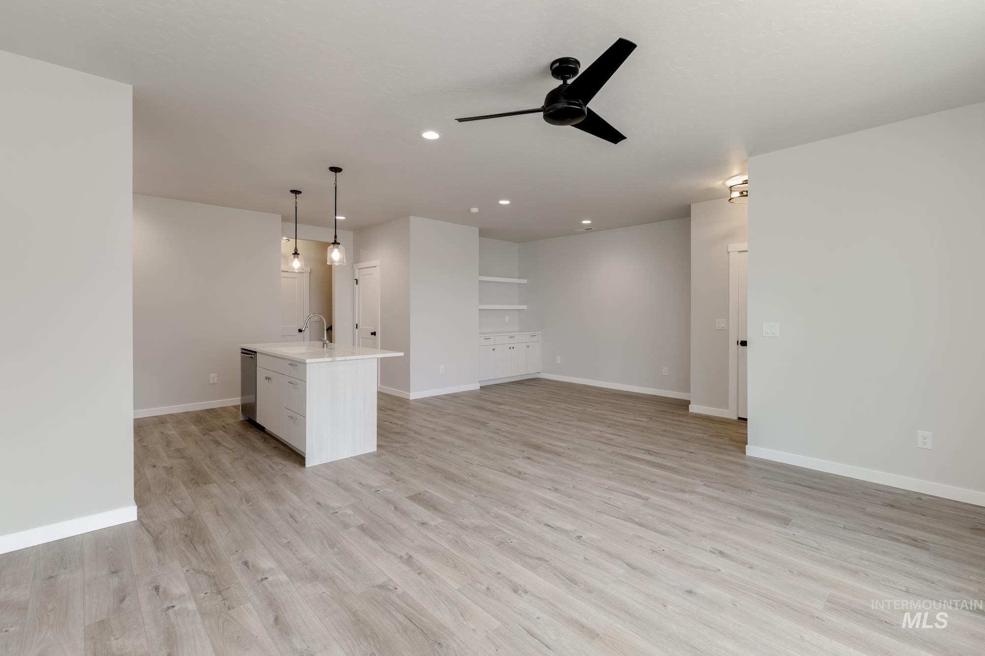 Unfurnished living room featuring recessed lighting, light wood-type flooring, and a ceiling fan