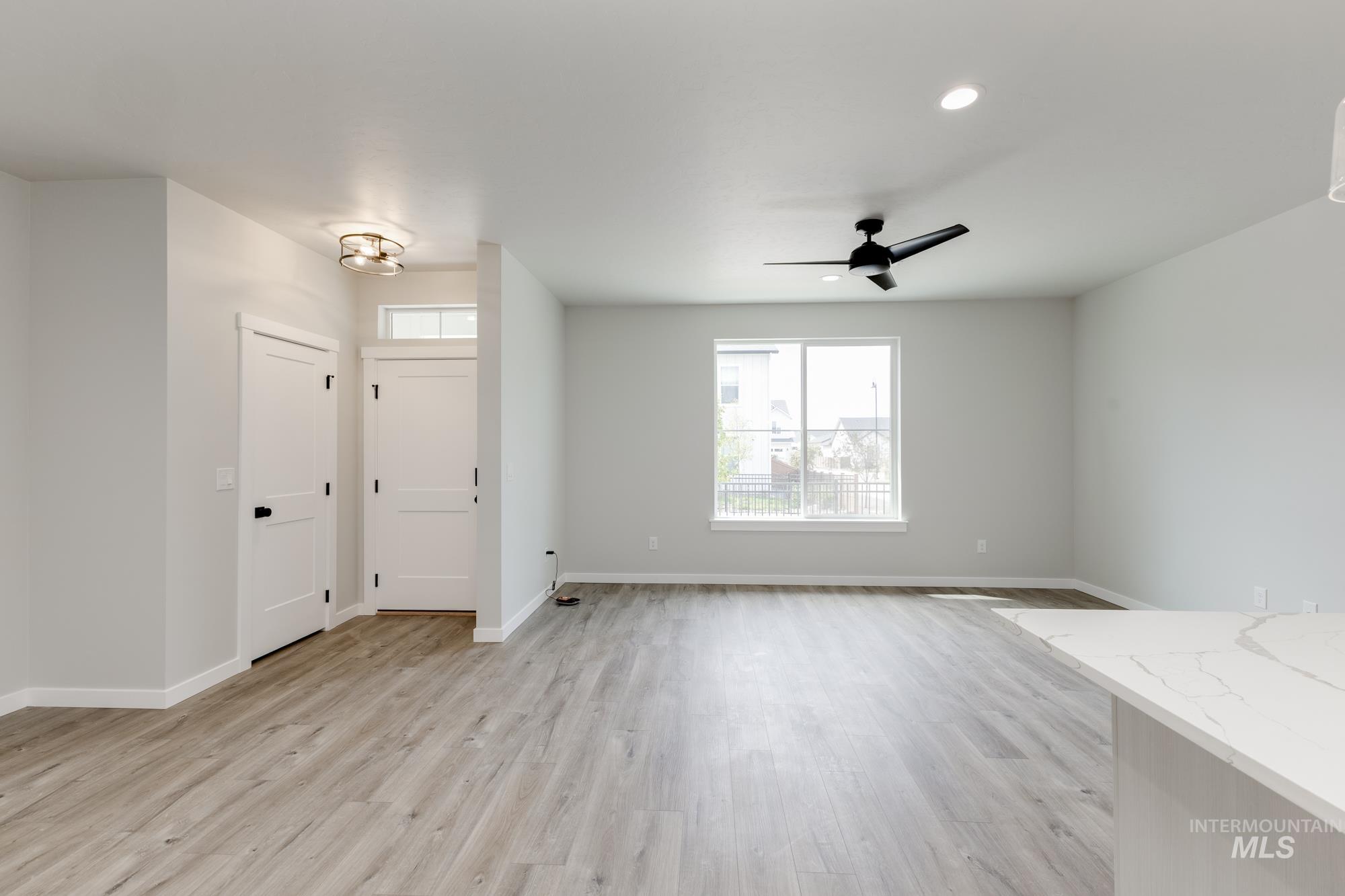 Entryway featuring light wood-type flooring, recessed lighting, and ceiling fan