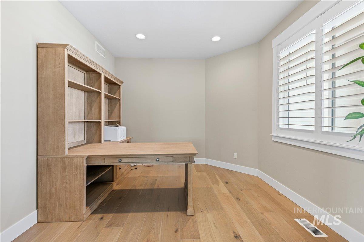 Office space featuring recessed lighting and light wood-type flooring