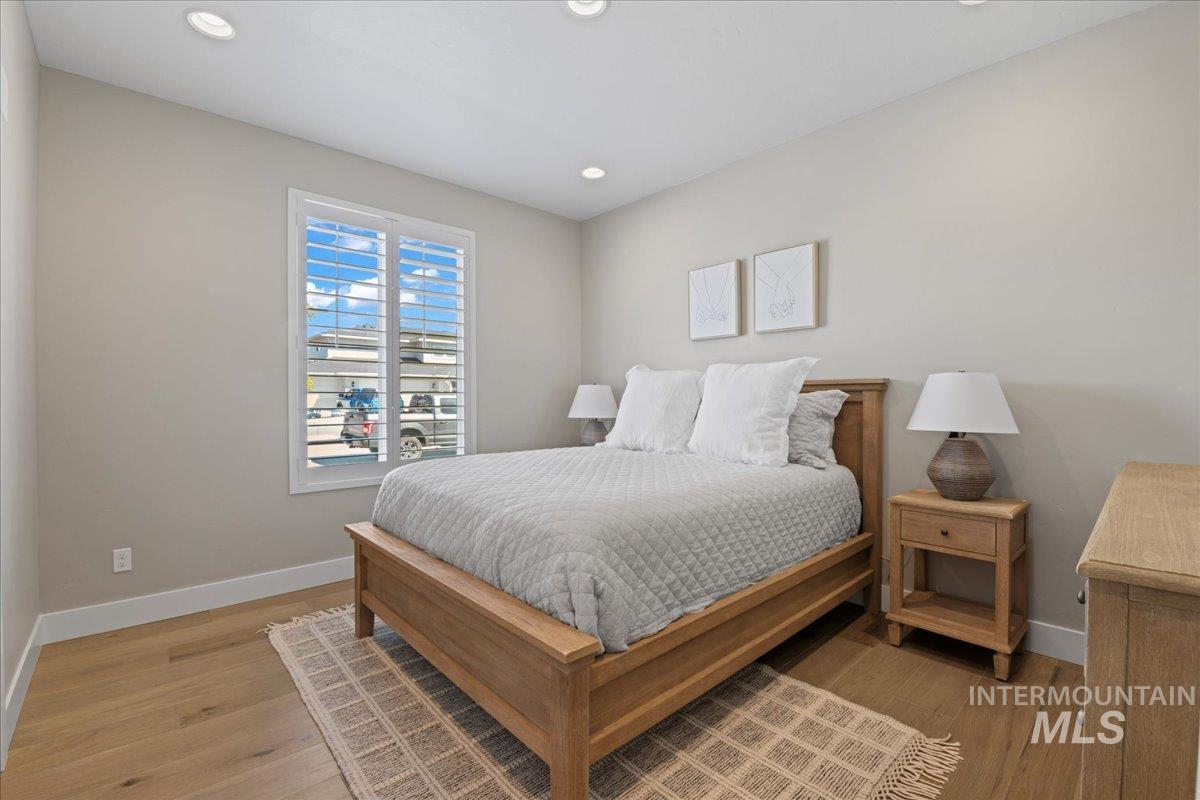 Bedroom featuring recessed lighting and light wood-type flooring