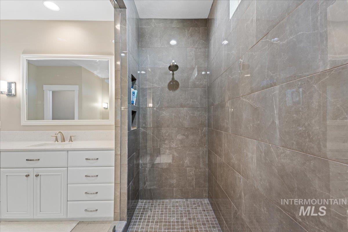 Bathroom with a walk in shower and vanity