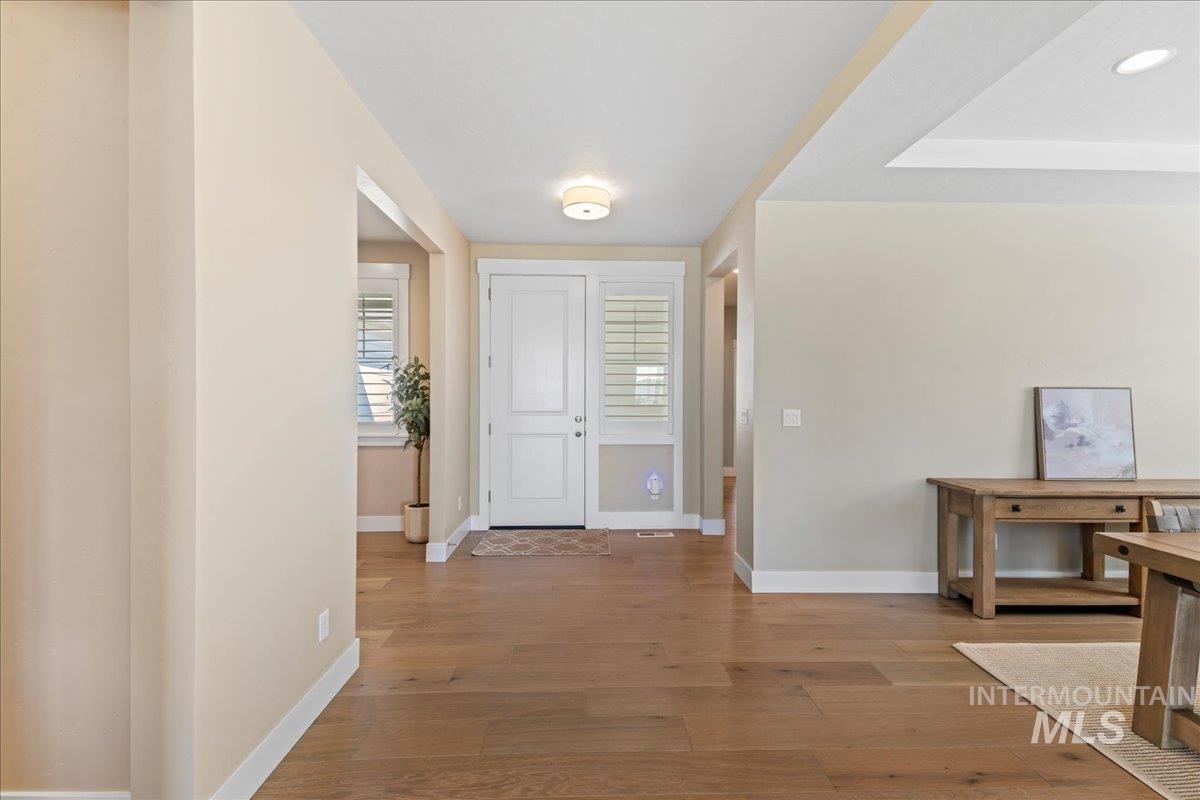 Entryway with light wood finished floors