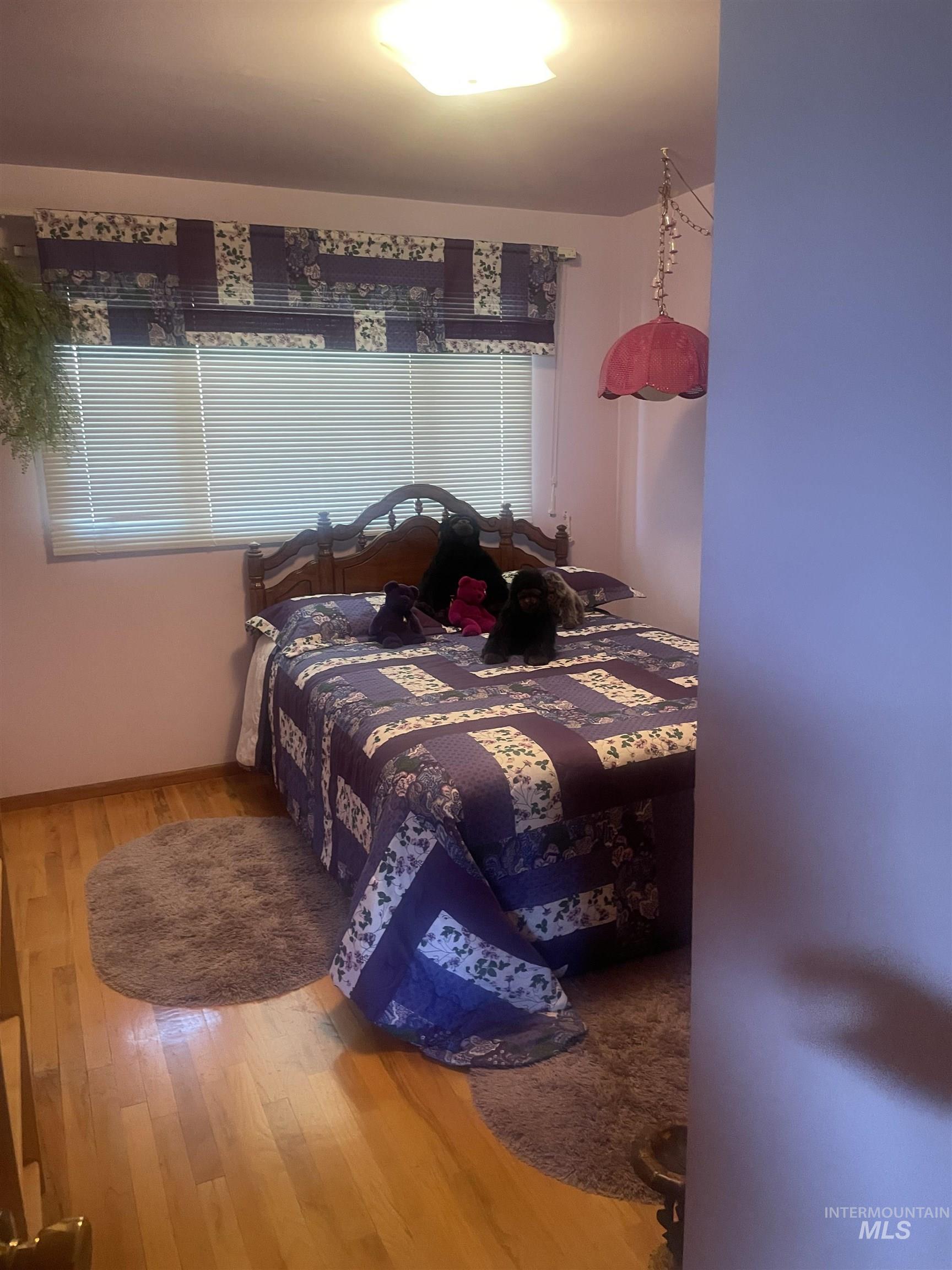 Bedroom with light wood-style flooring