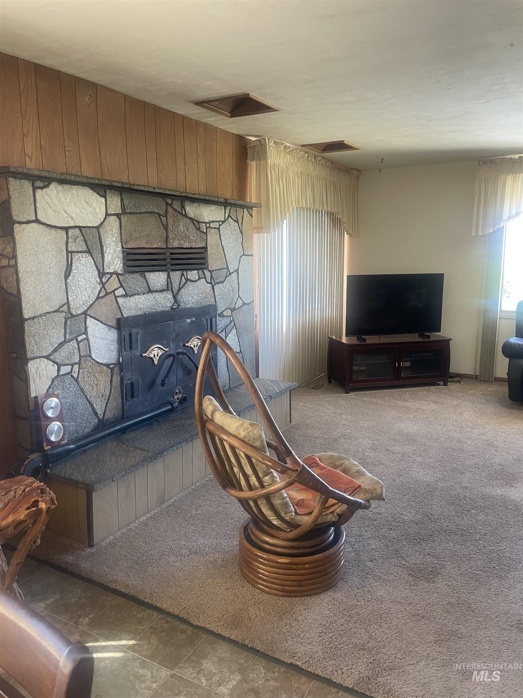 Living area featuring carpet flooring
