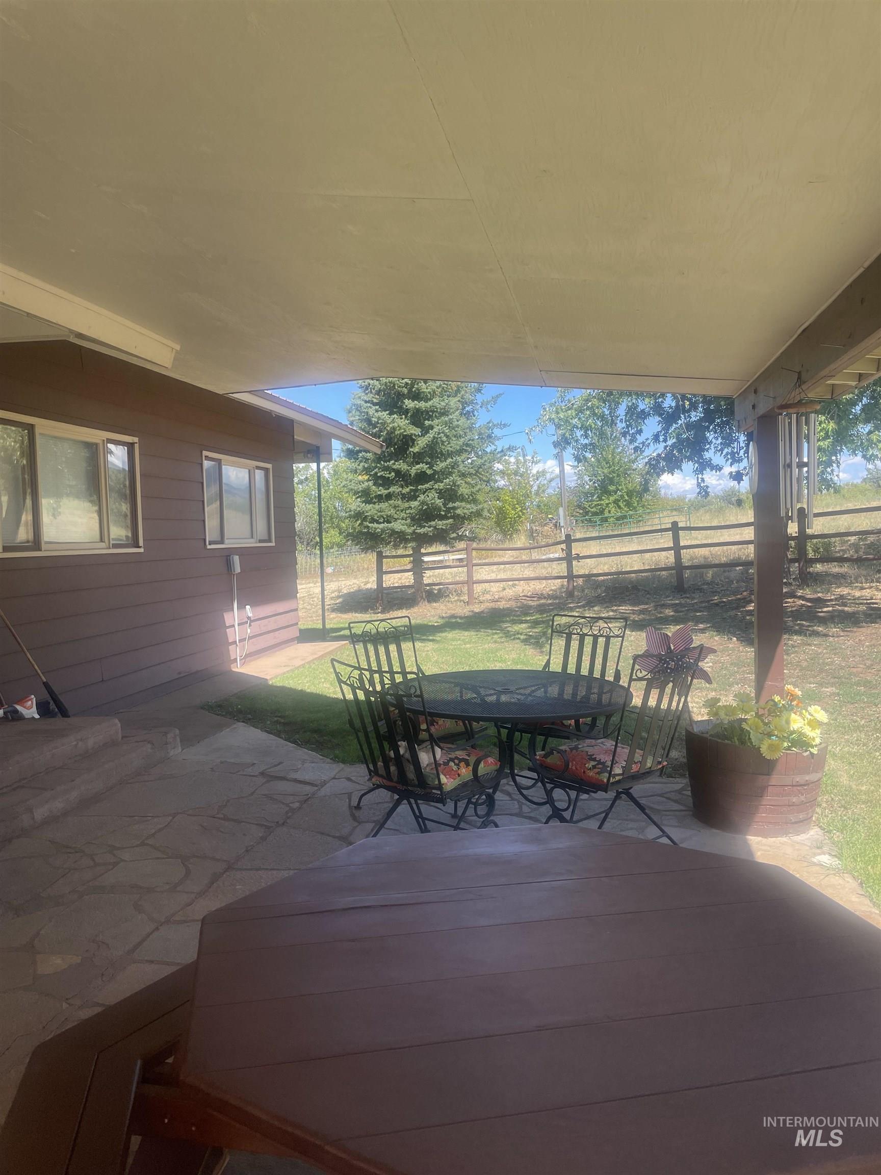View of patio featuring outdoor dining area