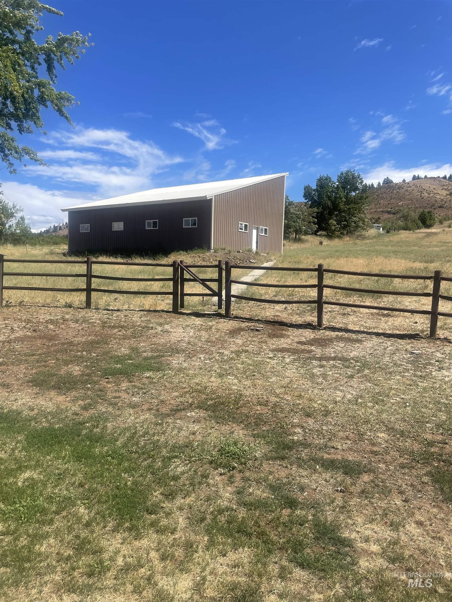 View of yard featuring an outbuilding and a view of rural / pastoral area
