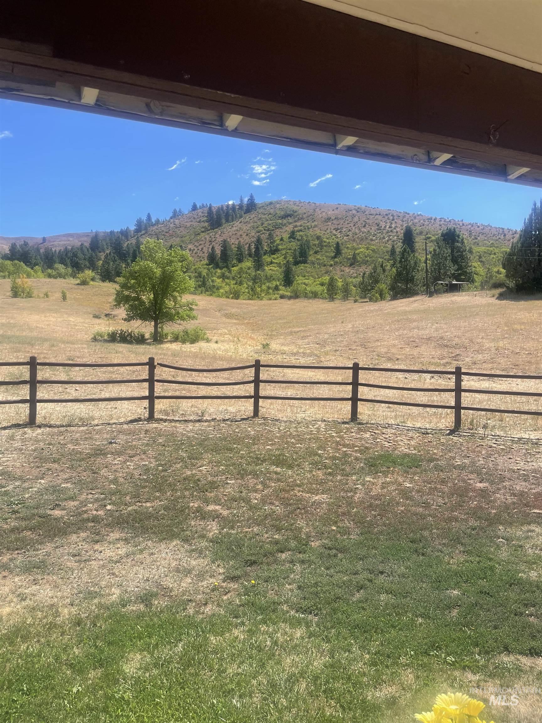 View of yard with a rural view