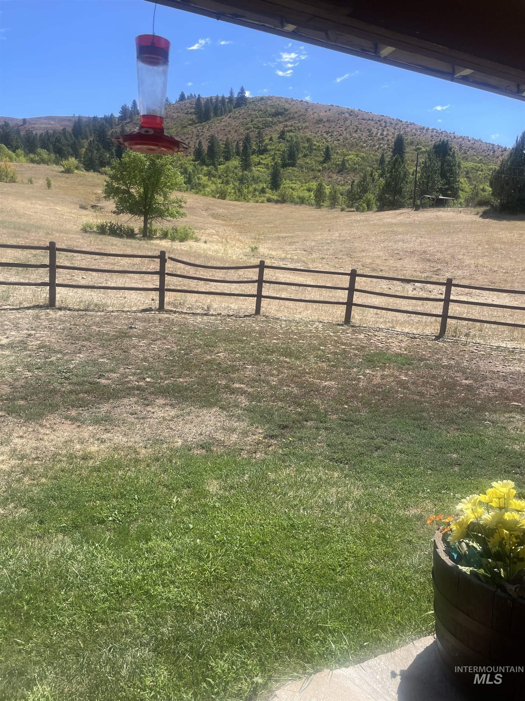 View of yard with a rural view