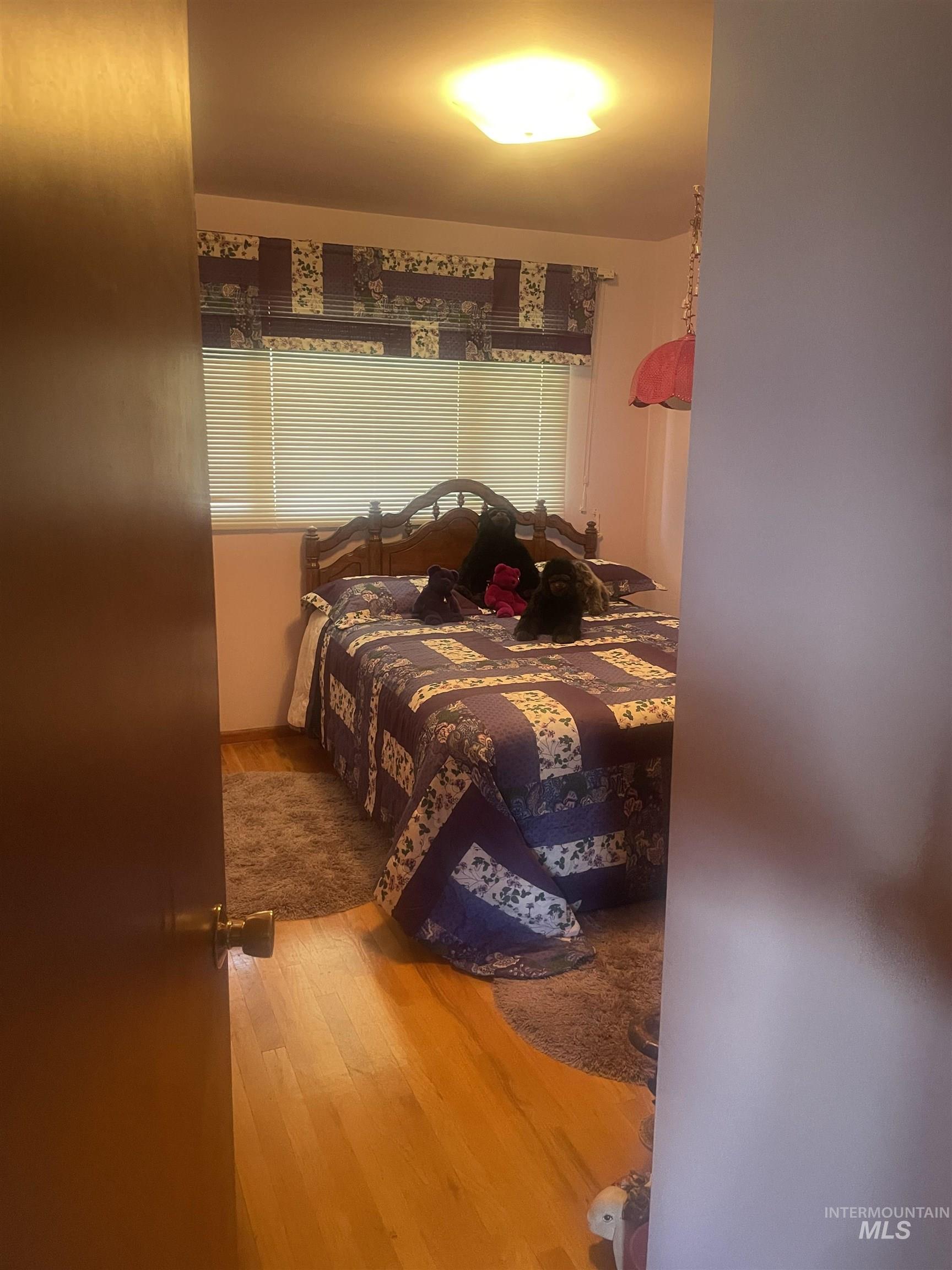 Bedroom featuring light wood-style flooring