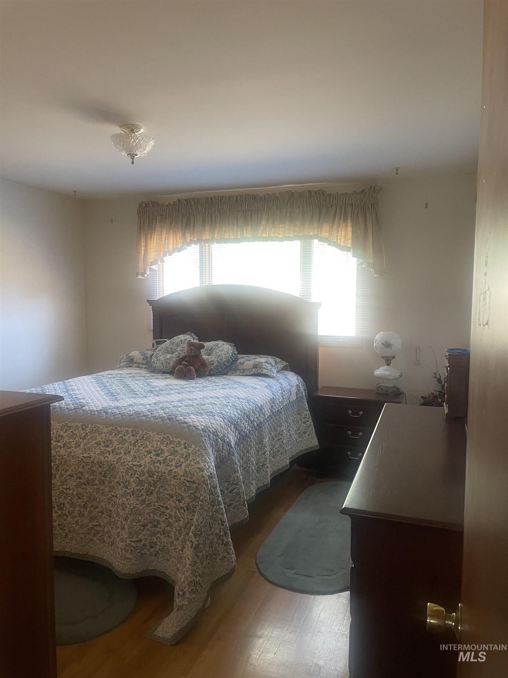 Bedroom with wood finished floors