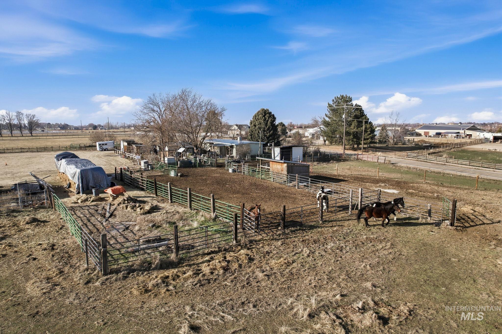 View of yard featuring a view of rural / pastoral area and an outbuilding