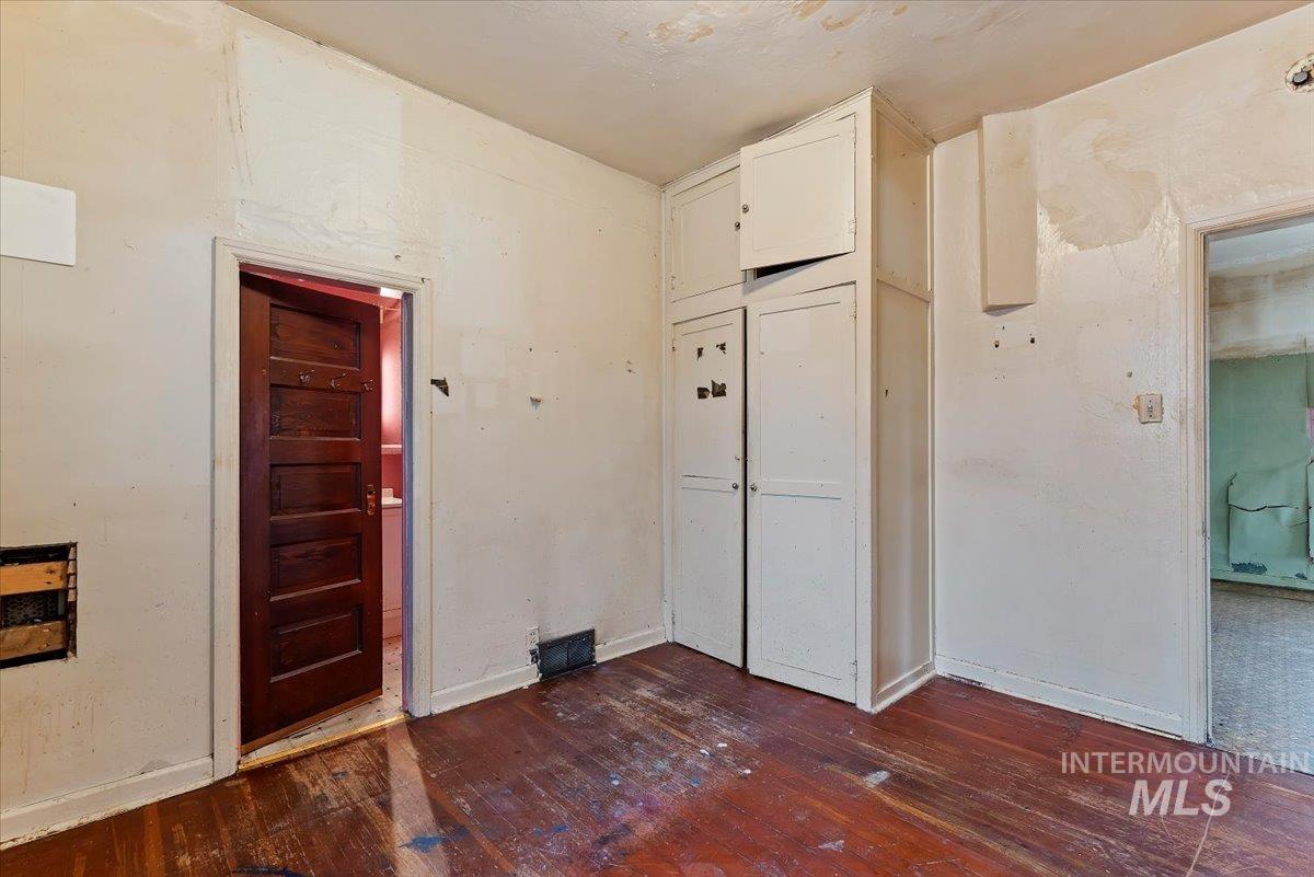 Wood floors with small built-in closet.....