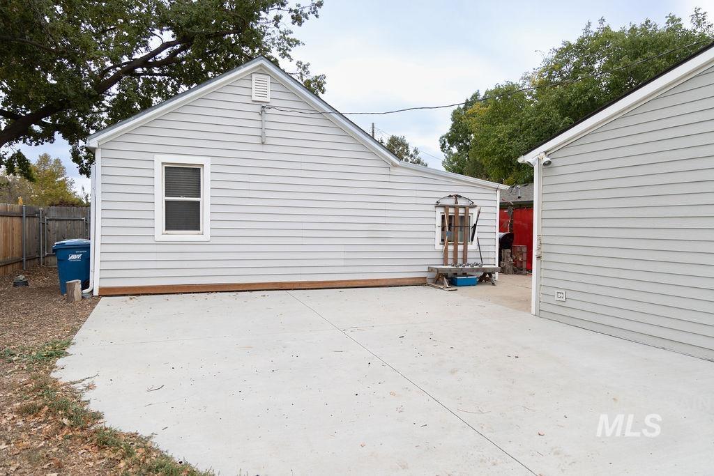 Back of property with a patio