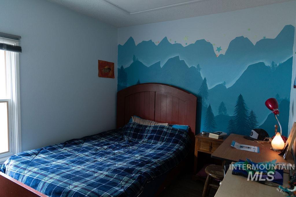 Bedroom featuring multiple windows