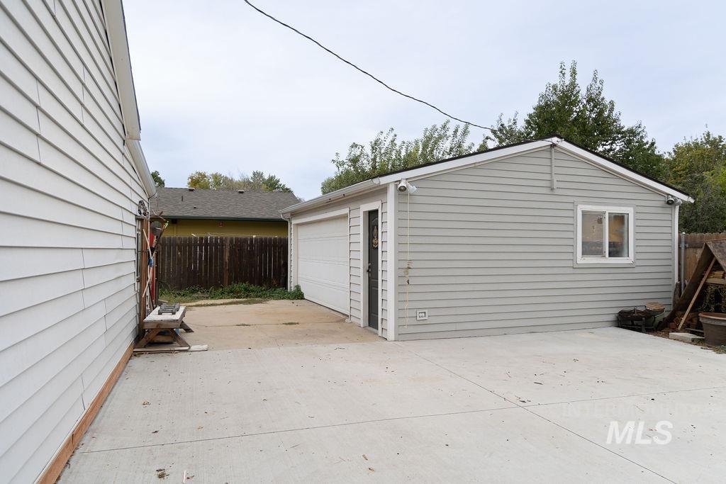 Detached garage with concrete driveway