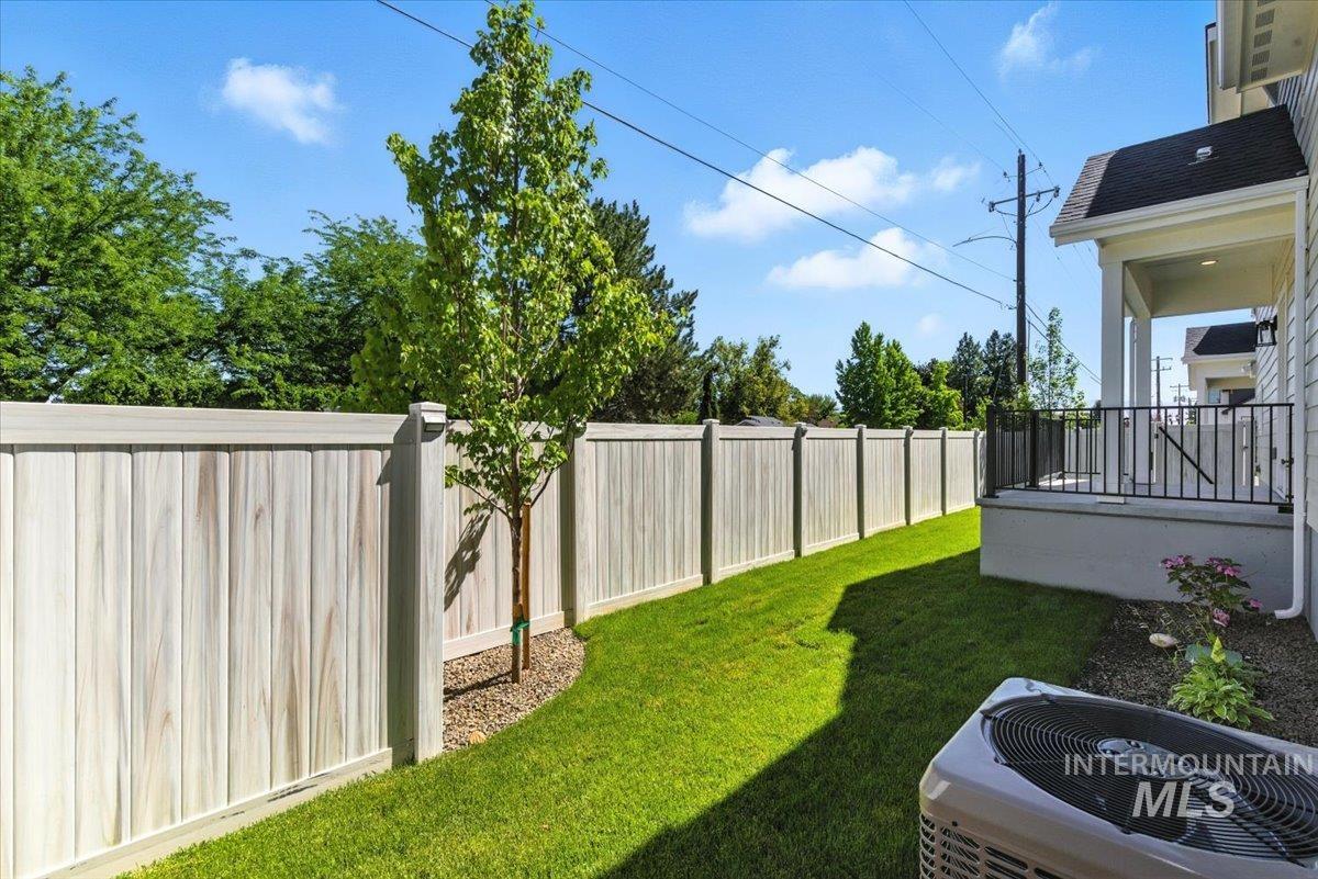 View of fenced backyard