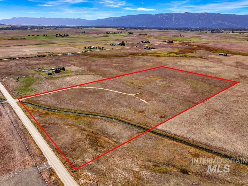 Aerial view of sparsely populated area with property boundaries highlighted