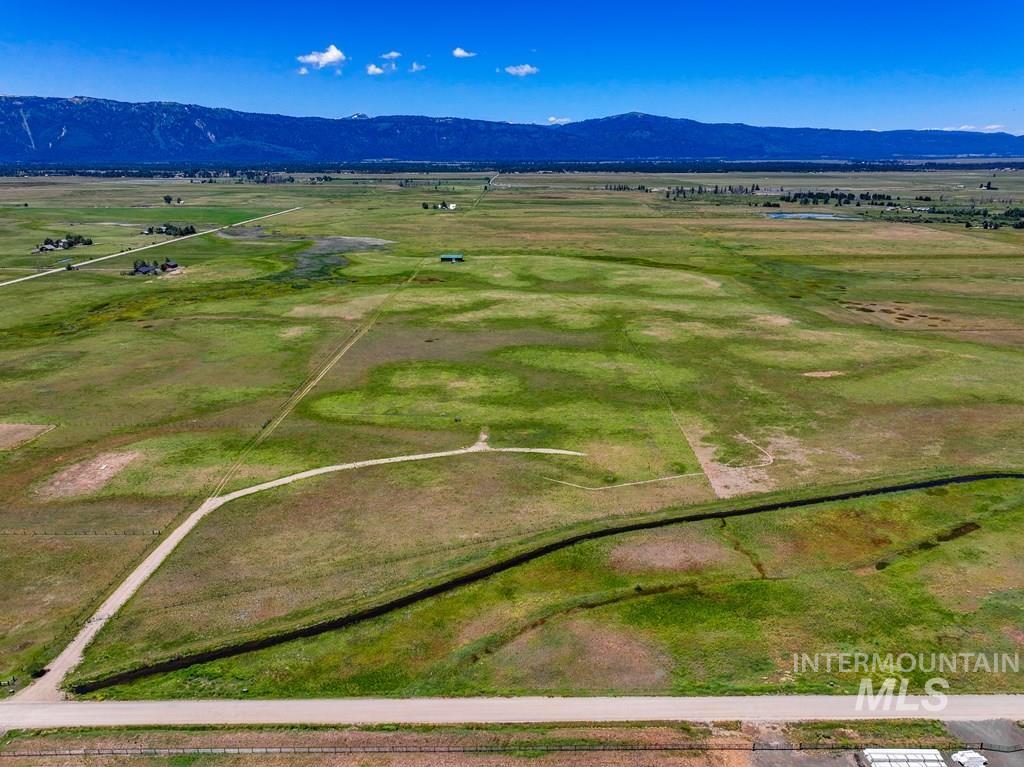 Aerial view of sparsely populated area with a mountainous background