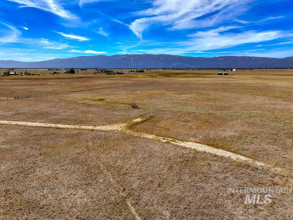 View of mountain background featuring rural landscape