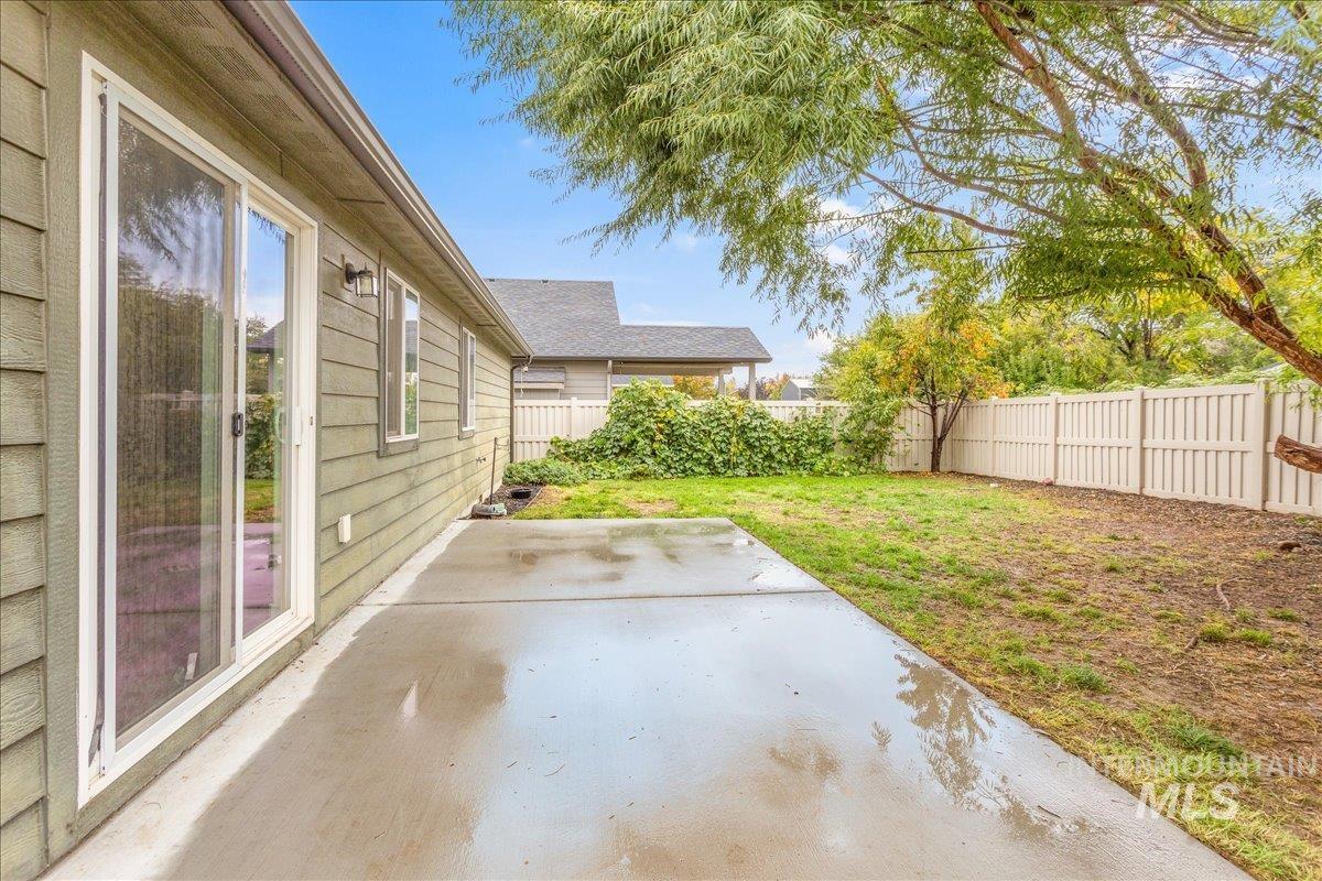 Fenced backyard featuring a patio area
