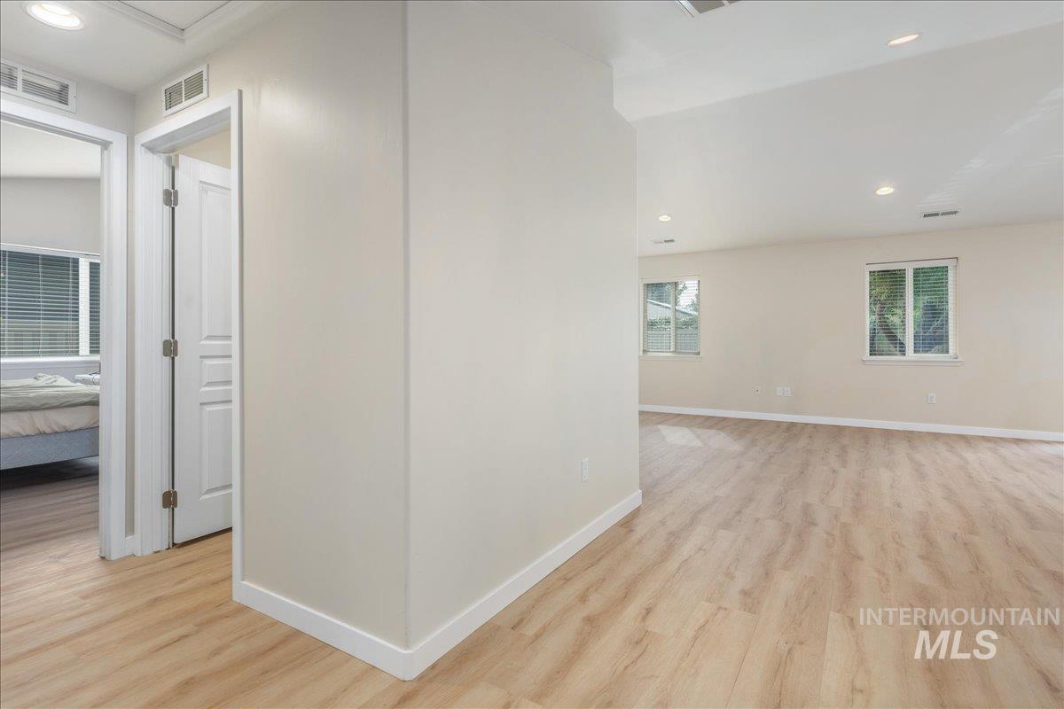 Hall featuring recessed lighting and light wood-style floors