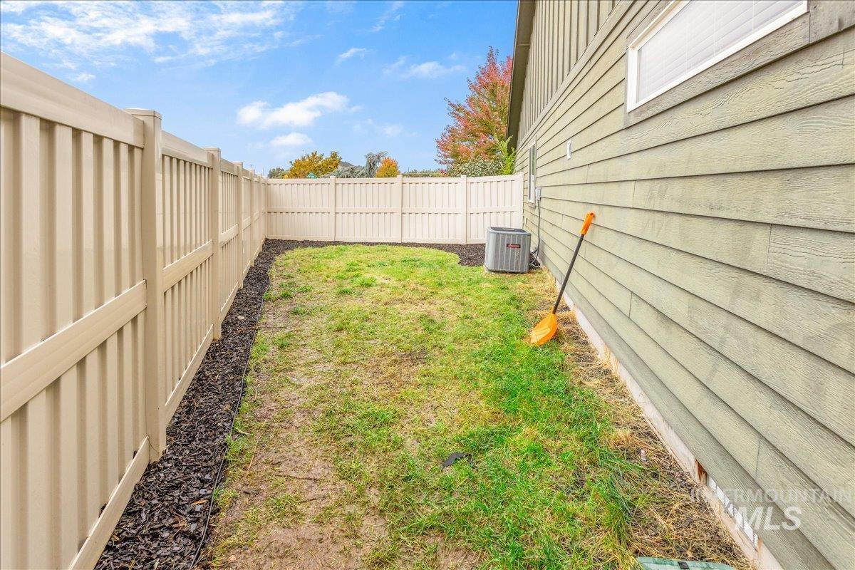 View of fenced backyard